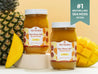 Sea moss gel jars with mango and pineapple fruit beside True Sea Moss branding