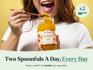 Woman eating mango pineapple sea moss gel with wooden spoon for daily serving